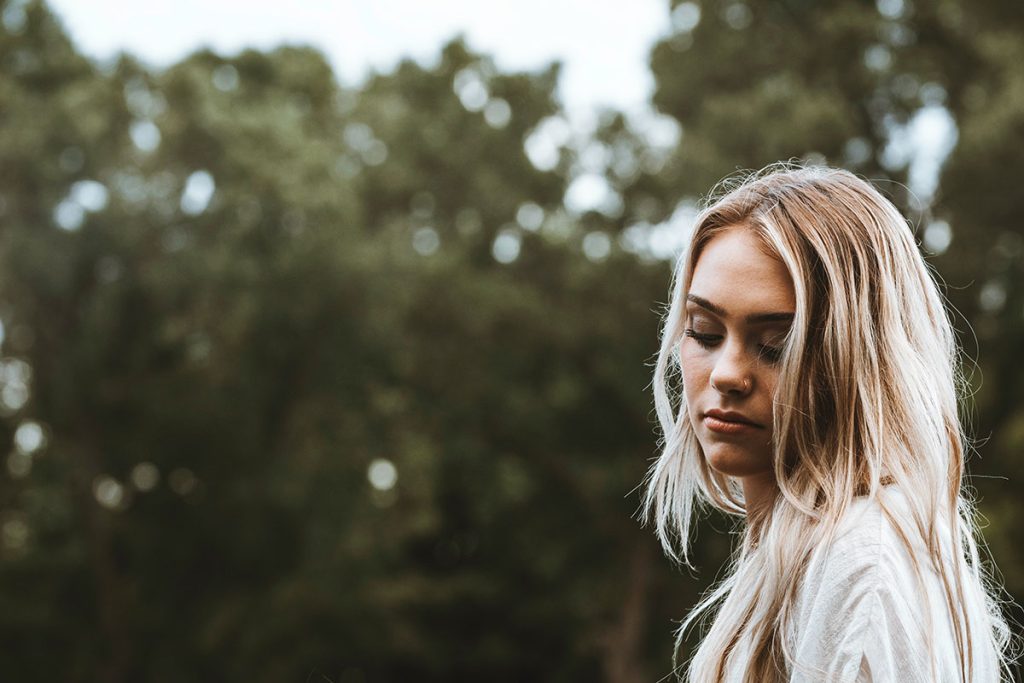 Pregnant woman thinking about her abusive partner