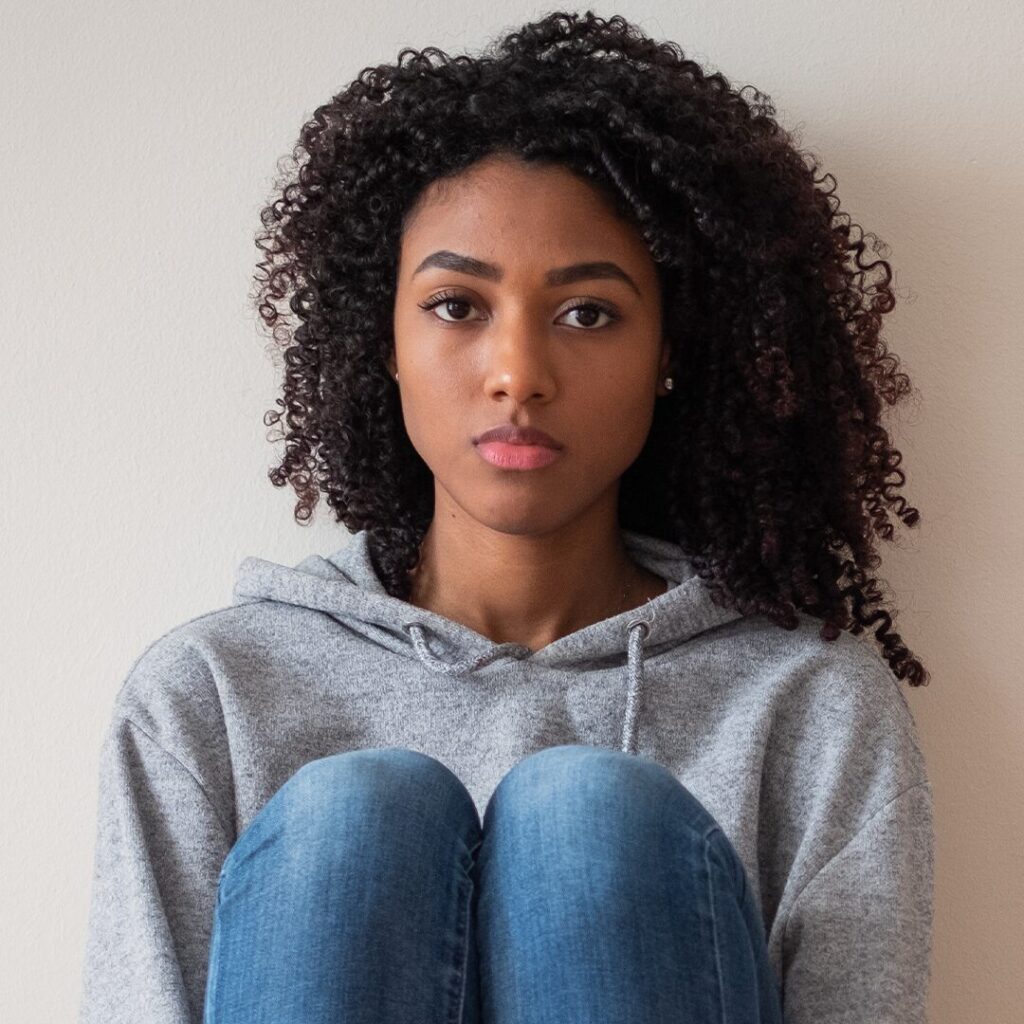 A woman thinking of how to support her friend that's dealing with an unplanned pregnancy